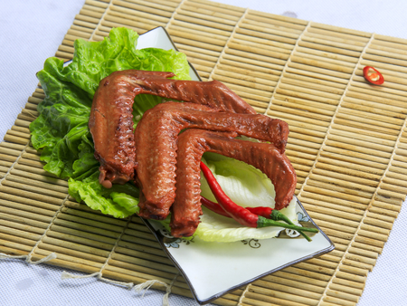 a plate of duck wingsの写真素材