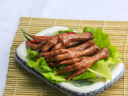 a plate of chicken feetの写真素材