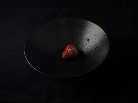 strawberry close up view on dark backgroundの写真素材