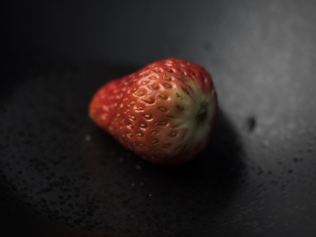 strawberry close up view on dark backgroundの写真素材