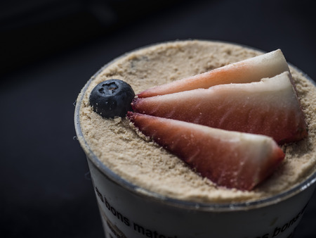 Top view of a strawberry cheesecake on dark backgroundの写真素材