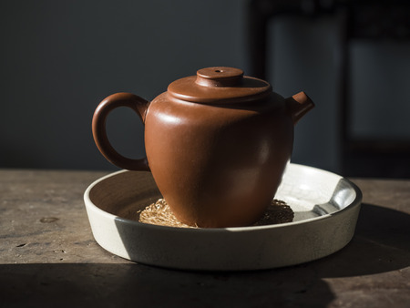 Teapot on a wooden backgroundの写真素材