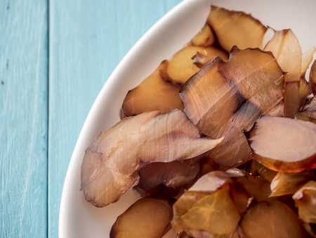 Beef tendon in a plate on blue backgroundの写真素材