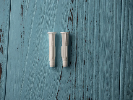 Plastic expansion on wooden blue backgroundの写真素材