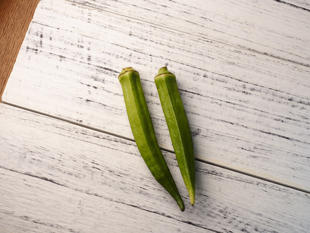 Lady fingers on a white wooden backgroundの写真素材