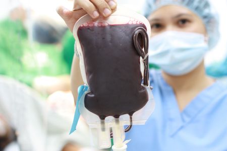 nurse holding a fresh donor blood for transfusion.narrow DOFの写真素材