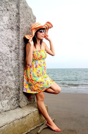young asian lady enjoying the beach viewの写真素材