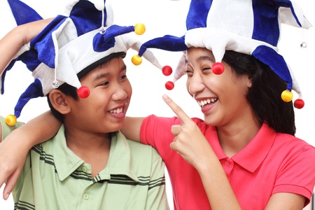 Yuong asian children wearing a clown hatの写真素材