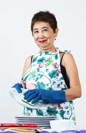 Senior asian woman washing dishes の写真素材