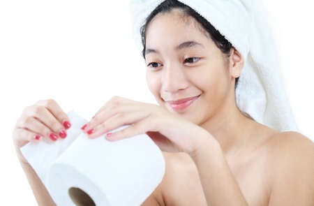 Lady holding a toilet paper isolated in white background.の写真素材