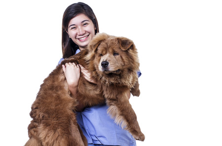 Happy asian lady carrying a dog. Isolated in white background.の写真素材