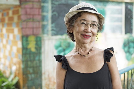 Potrait of a happy old asian woman.の写真素材