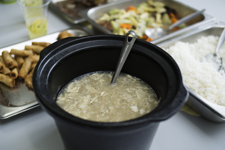 Delicious hot egg soup served in a party.の写真素材