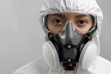 Portrait of a female health worker on full personal protective equipment PPE.の写真素材
