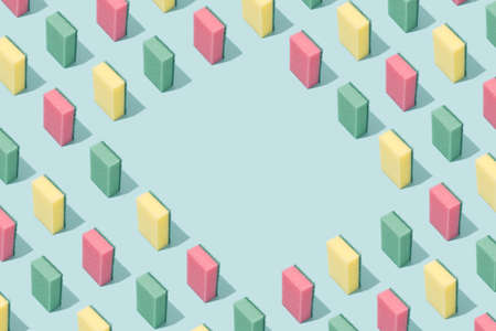 Cleaning sponges pattern on a light blue background. Creative idea minimal concept.