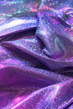 Holographic violet cloth background.  Futuristic retro concept.の写真素材