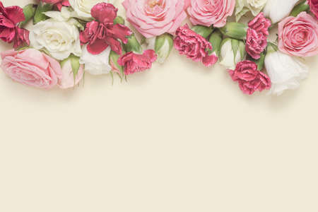 Spring flowers arranged against the pastel yellow background. Valentine's day, wedding backdrop.の写真素材