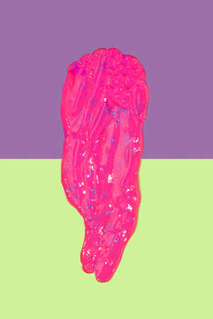 Two tone colorful background with paint color smear in the middle. Future past minimal concept.の写真素材