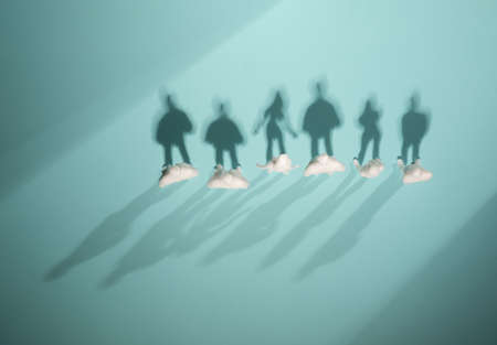 Group of people top view with double shadow silhouettes. Personality, individuality surreal concept.の写真素材