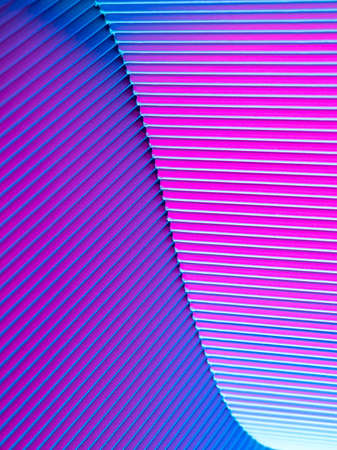 Abstract geometric background with pink and blue hues. Corrugated lines futuristic backdrop.