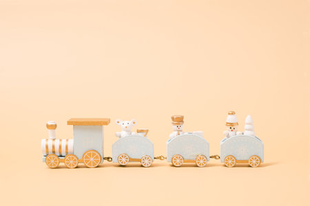 Christmas decoration train with winter ornaments on a golden background. Xmas traditional template