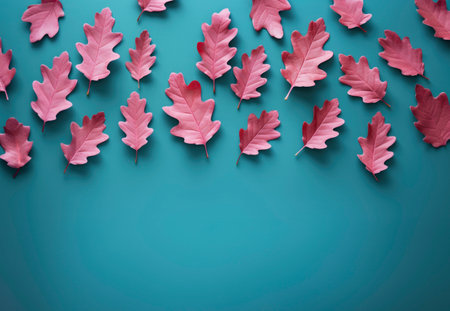 Pink oak leaves on a pastel teal background. Minimal thanksgiving pattern flat lay. AI generated backgroundの素材
