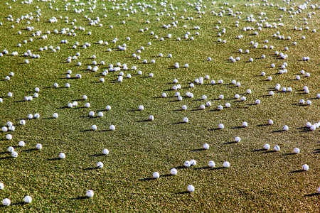 Golf balls on the courtの写真素材