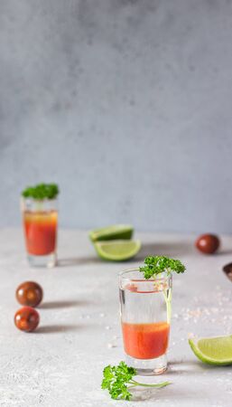 Bloody Mary cocktail and ingredients, copy space. Classic tomato cocktail with vodka.の写真素材