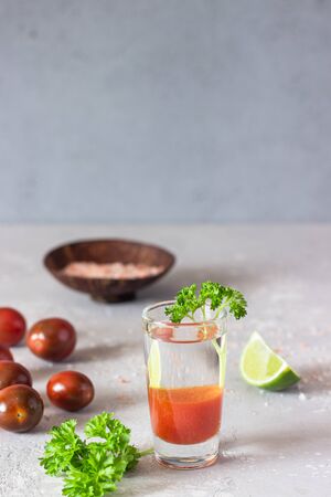 Bloody Mary cocktail and ingredients, copy space. Classic tomato cocktail with vodka.の写真素材