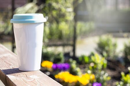 Reusable cup, natural morning background. Zero waste concept. Eco-friendly cup for take away drinks.の写真素材