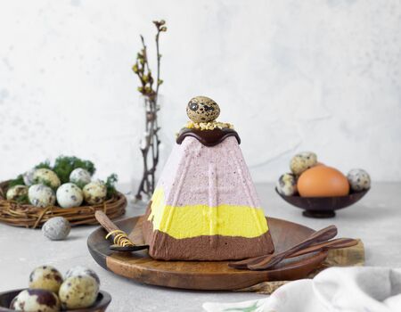Layered paskha with chocolate, berries and curcuma. Traditional Russian or Ukrainian Orthodox Easter...