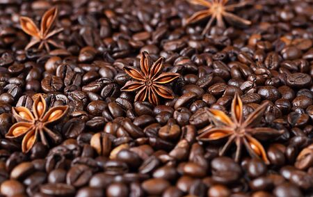 Coffee beans background with anise stars. Christmas concept. Selective focus. Monochrome image. Food background.の写真素材