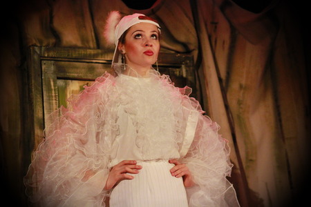 Beautiful girl in a suit of dove Plays a scene from a fairy tale