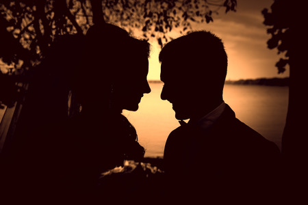 Bride and groom look at each otherの写真素材