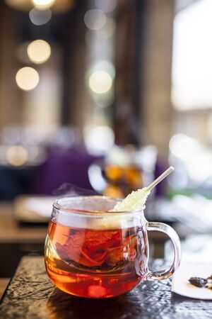 Sweet cup of tea with candy and relaxの写真素材
