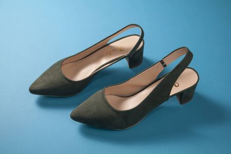 A pair of dark green kitten heels shoesの写真素材