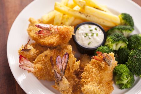 Fried shrimp with fried potatoの写真素材