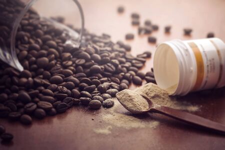 coffee beans with powder spoonの写真素材