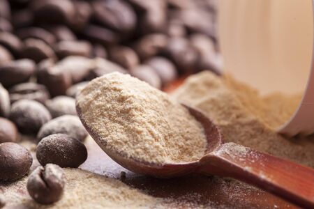 coffee beans with powder spoonの写真素材