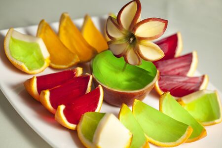 Colored jellies poured into the fruit skinの写真素材