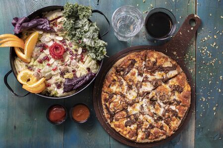 Delicious pizza with saladの写真素材