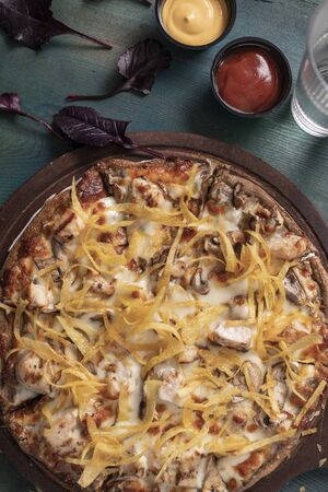 Alfredo Chicken Pizza And fried potatoesの写真素材