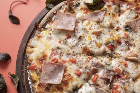 Turkey bacon pizza in red backgroundの写真素材