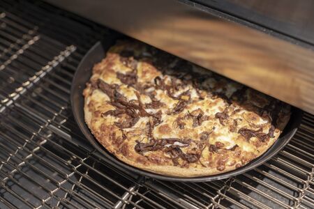 pizza inside the pizza makerの写真素材