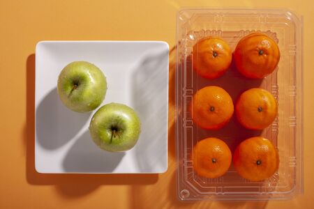 Oranges and apples from top viewの写真素材