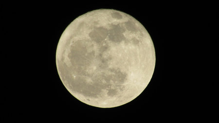 Full moon in the night sky. Close-up of a full moon.