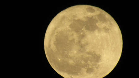 Highly detailed photo of the bright full moon in the night.の写真素材