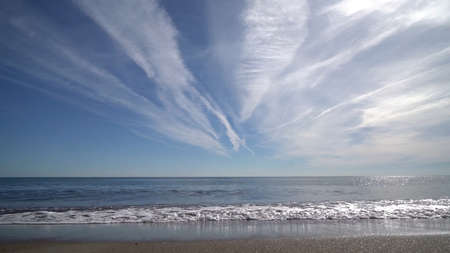 Tropical beach with blurred horizon at sunset.の写真素材