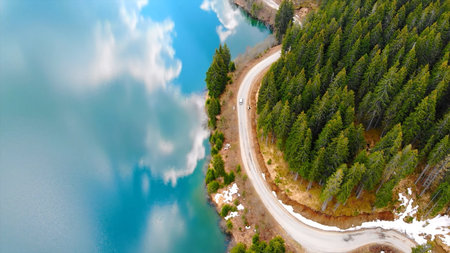 Aerial panoramic view of the mountain lake in the forest. Beautiful mountain lake with a winding...