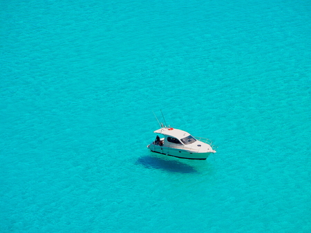 Boat that seems to fly on a beautiful turquoise seaの写真素材